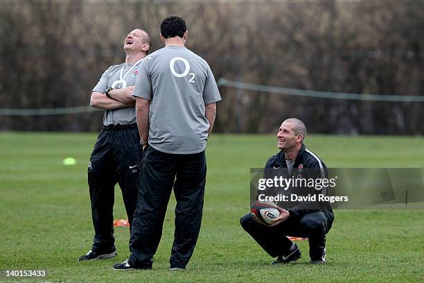 England head coach Stuart Lancaster shares a joke with his assistant coaches Graham Rowntree and Andy Farrell during the England training session at...