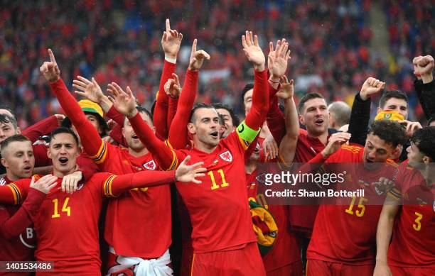 Gareth Bale of Wales celebrates with team mates victory in the FIFA World Cup Qualifier between Wales and Ukraine at Cardiff City Stadium on June 05,...