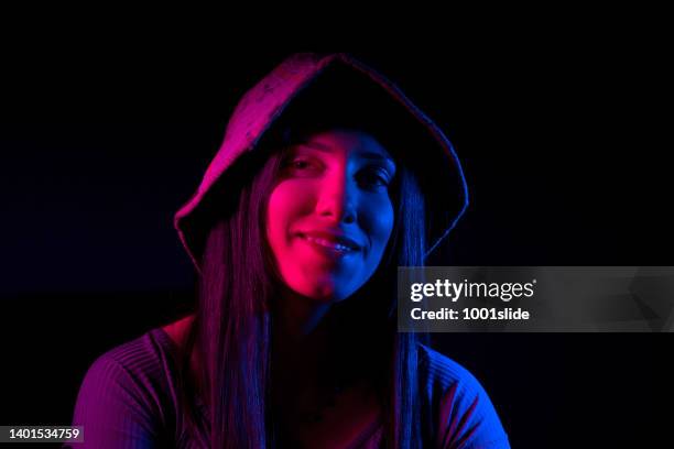 woman with red and dark blue gel lighting. - gel effect lighting stock pictures, royalty-free photos & images