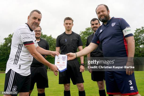The team captains are seen ahead of a fan match prior to the UEFA Nations League match between Germany and England at Allianz Arena on June 07, 2022...