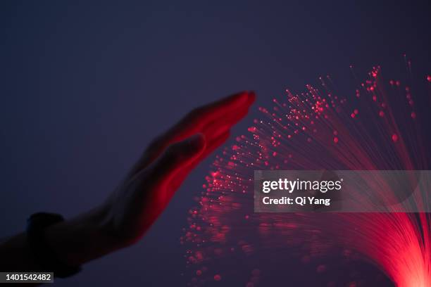 close-up of finger touching fiber - sensory perception stockfoto's en -beelden