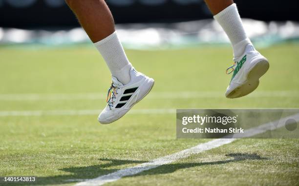 Jay Clarke of Great Britain wears rainbow laces against Paul Jubb of Great Britain during the Men's Singles First Round match on day 4 of The...