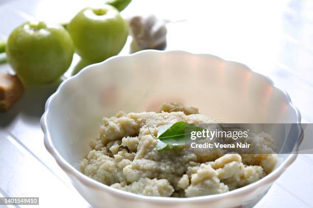 indian gooseberry/amla chutney in a white ceramic bowl - チャツネ ストックフォトと画像