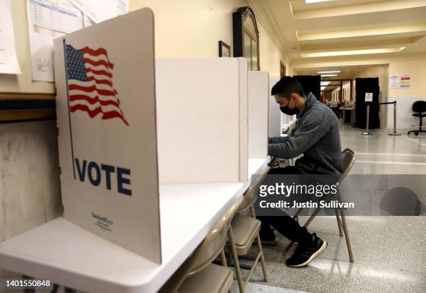 Voter fills out his ballot in a polling station at San Francisco City Hall on June 07, 2022 in San Francisco. California. California voters are...