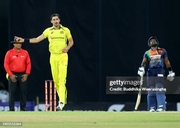 Australian bowler Mitchell Marsh celebrates after taking the wicket of Sri Lakan bastman Pathum Nissanka during the 1st match in the T20...