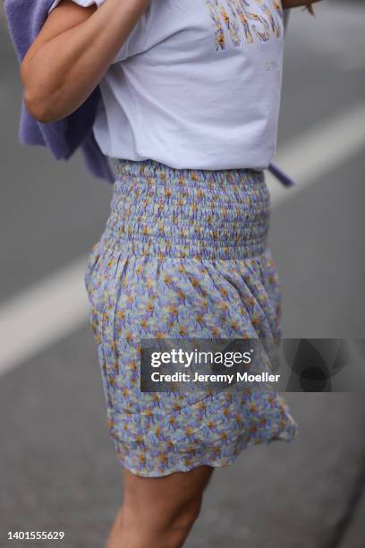 Anna Wolfers seen wearing a white shirt with front floral print and a short skirt with floral print on June 02, 2022 in Hamburg, Germany.