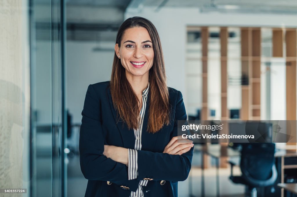 Confident businesswoman in modern office.