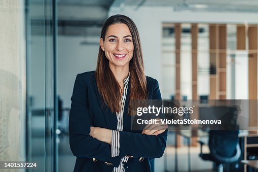 Confident businesswoman in modern office. Confident businesswoman in modern office.