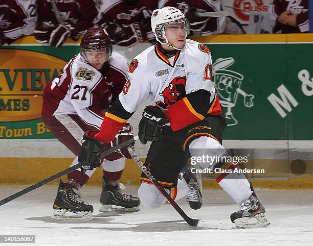 Adam Payerl of the Belleville Bulls grimaces after a high puck hit him in a game against the Peterborough Petes on February 26, 2012 at the...