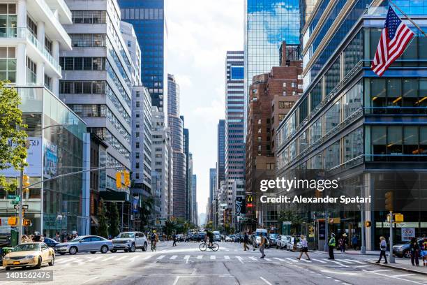 skyscrapers on 3rd avenue in midtown manhattan, new york city, usa - city street fotografías e imágenes de stock