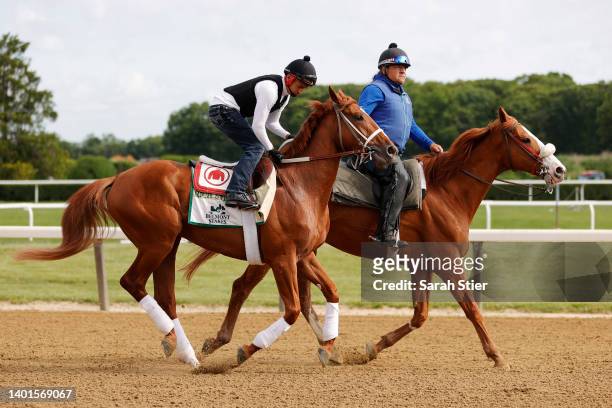 Rich Strike and his exercise rider train on the track during a morning workout prior to the 154th running of the Belmont Stakes at Belmont Park on...