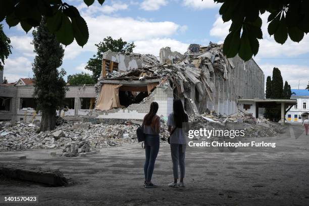 Two girls view the remains of the bomb destroyed Lyceum Number 25 School on June 07, 2022 in Zhytomyr, Ukraine. The School was hit by a Russian...