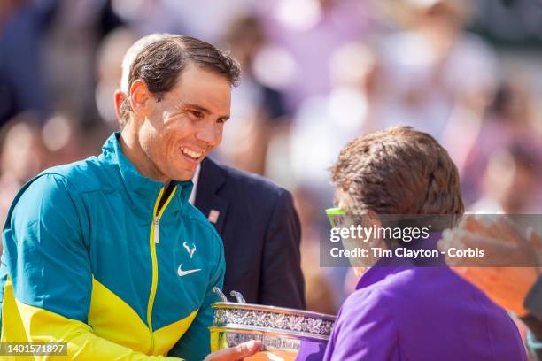Rafael Nadal of Spain receives the winners trophy from Billie Jean King after his victory against Casper Rudd of Norway during the Singles Final for...