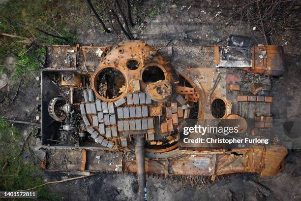 Destroyed Russian tank begins to rust in woodland near Kyiv on June 07, 2022 in Kyiv, Ukraine. A sense of normality has increasingly returned to Kyiv...