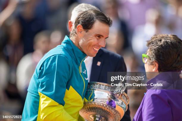 Rafael Nadal of Spain receives the winners trophy from Billie Jean King after his victory against Casper Rudd of Norway during the Singles Final for...