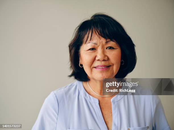 portrait of a mature woman - mature women portrait asian stock pictures, royalty-free photos & images