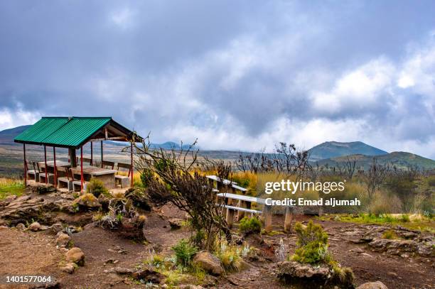 view deck and cottage in mount kilimanjaro, mandara hut camp to horombo hut camp, heather and moorland zone, tanzania - mandara lakes stock pictures, royalty-free photos & images