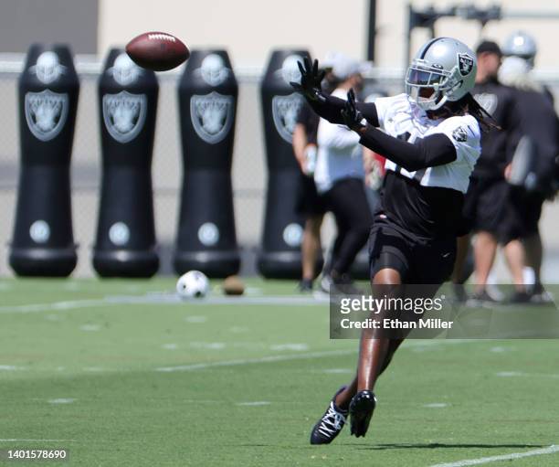 Wide receiver Davante Adams of the Las Vegas Raiders catches a pass during mandatory minicamp at the Las Vegas Raiders Headquarters/Intermountain...
