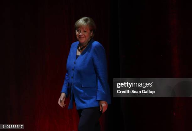 Former German Chancellor Angela Merkel arrives for a conversation with journalist Alexander Osang on stage at the Berliner Ensemble theatre on June...