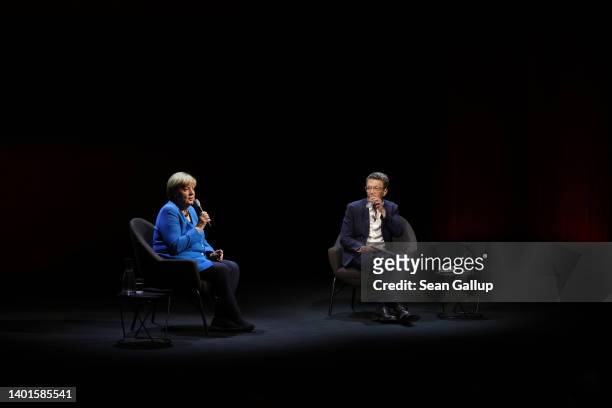 Former German Chancellor Angela Merkel sits down for a conversation with journalist Alexander Osang on stage at the Berliner Ensemble theatre on June...