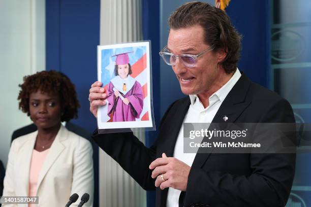After meeting with President Joe Biden, actor Matthew McConaughey holds up a photograph of one of the victims of the school shooting in Uvalde,...