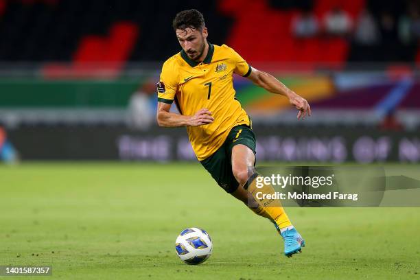 Mathew Leckie of Australia runs with the ball during the 2022 FIFA World Cup Playoff match between United Arab Emirates and Australia at Ahmad Bin...