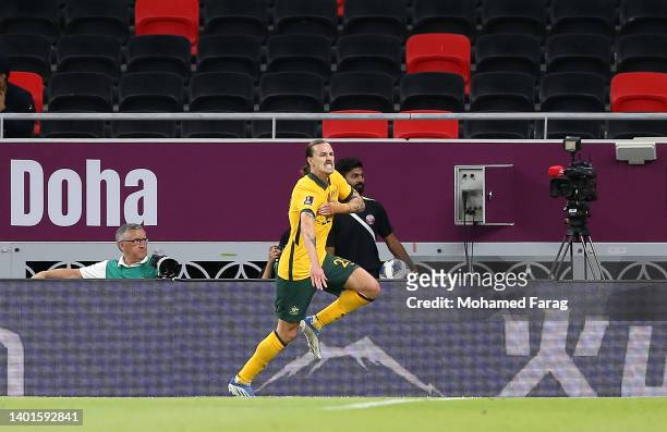 Jackson Irvine of Australia celebrates after scoring their side's first goal during the 2022 FIFA World Cup Playoff match between United Arab...