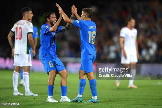 Nicolo Barella celebrates with Davide Calabria of Italy after scoring their team's first goal during the UEFA Nations League League A Group 3 match...