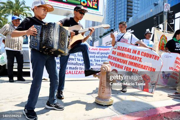 Demonstrators calling for immigration reform gather outside the Los Angeles Convention Center, the location for the Ninth Summit of the Americas, on...