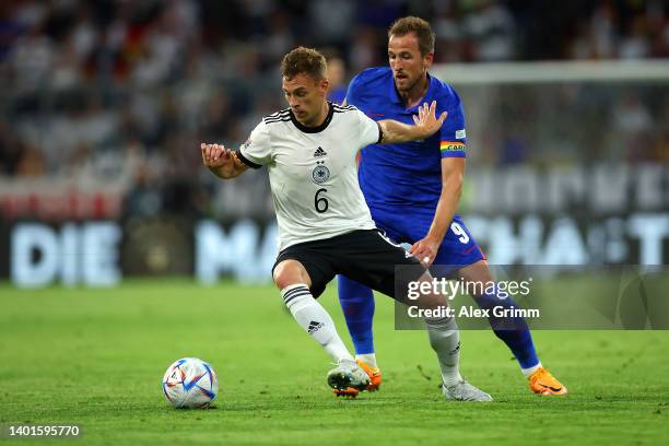 Joshua Kimmich of Germany is challenged by Harry Kane of England during the UEFA Nations League League A Group 3 match between Germany and England at...