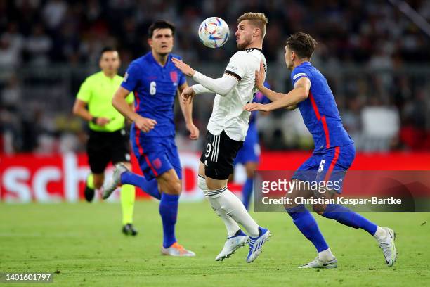 Timo Werner of Germany is challenged by John Stones of England during the UEFA Nations League League A Group 3 match between Germany and England at...