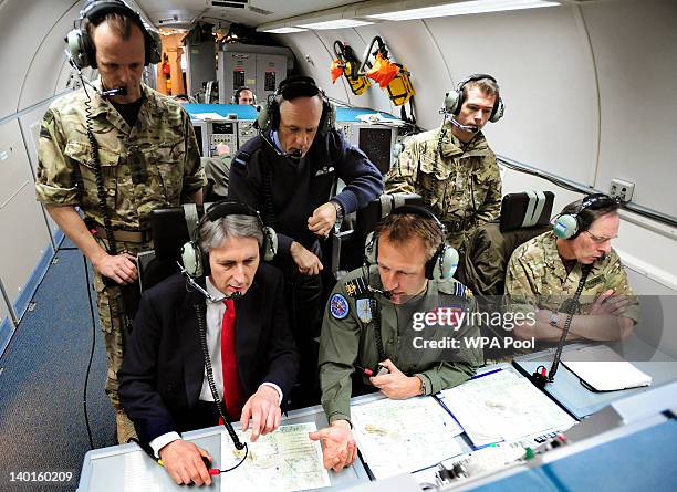 The Secretary of State for Defence, Philip Hammond observes an Olympic training exercise codenamed Exercise Taurus Mountain 2, during a flight on the...