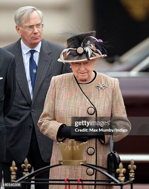 Prince Richard, The Duke of Gloucester looks on as Queen Elizabeth II prepares to unveil the first Jubilee Greenway Disc outside the central gates of...