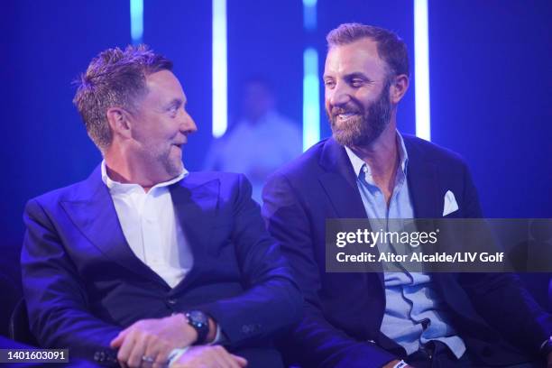 Ian Poulter of England and Dustin Johnson of The United States look on during the LIV Golf Invitational - London Draft on June 07, 2022 in London,...