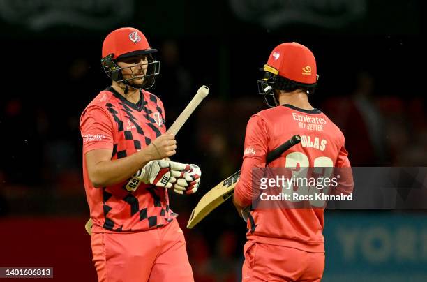 Tim David of Lancashire and Dane Vilas of Lancashire celebrate after the Vitality T20 Blast between Leicestershire Foxes and Lancashire Lightning at...