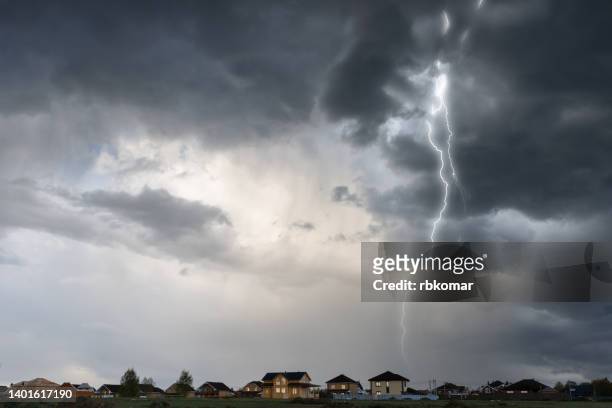 cloud storm sky with thunderbolt over the village in rural scene - storm bildbanksfoton och bilder