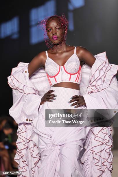 Model walks the runway for the Christopher John Rogers Collection 010 runway show at Brooklyn Navy Yard on June 07, 2022 in Brooklyn, New York.