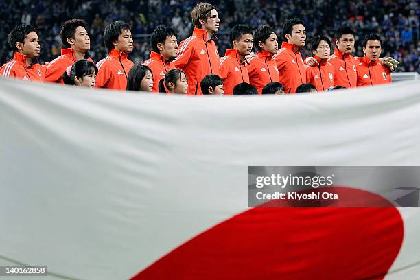 The Japan team players line up as they sing the national anthem prior to the 2014 FIFA World Cup Brazil Asian 3rd Qualifier match between Japan and...