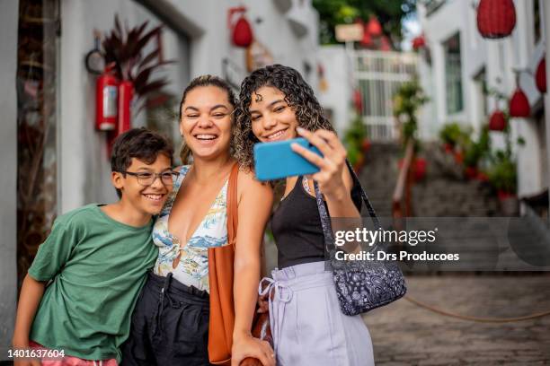 family taking selfie in the city - rio grande city stock pictures, royalty-free photos & images