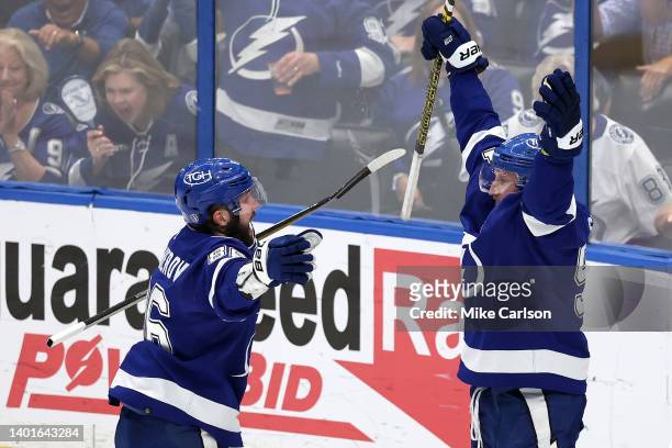 Steven Stamkos of the Tampa Bay Lightning celebrates with Nikita Kucherov after scoring a goal on Igor Shesterkin of the New York Rangers during the...