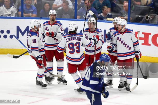Artemi Panarin of the New York Rangers celebrates with his teammates after scoring a goal on Andrei Vasilevskiy of the Tampa Bay Lightning during the...