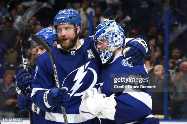 Victor Hedman and Andrei Vasilevskiy of the Tampa Bay Lightning celebrate defeating the New York Rangers with a score of 4 to 1 in Game Four of the...