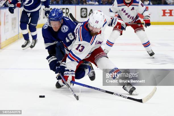 Ondrej Palat of the Tampa Bay Lightning collides with Alexis Lafreniere of the New York Rangers during the third period in Game Four of the Eastern...