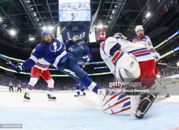 Pat Maroon of the Tampa Bay Lightning falls to the ice against the New York Rangers during the first period in Game Four of the Eastern Conference...