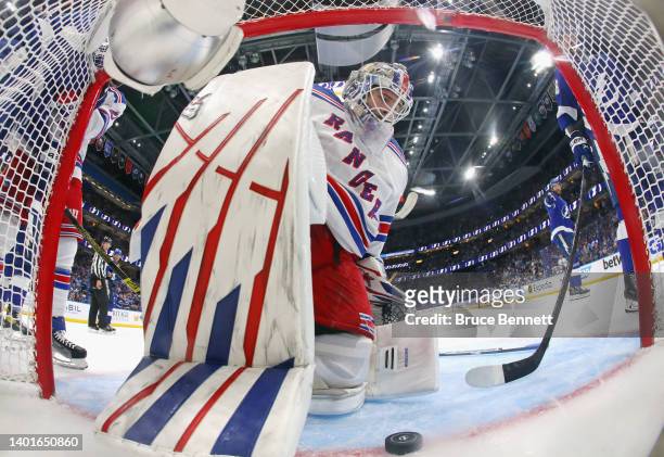 Igor Shesterkin of the New York Rangers reacts after making a diving save against the Tampa Bay Lightning during the first period in Game Four of the...