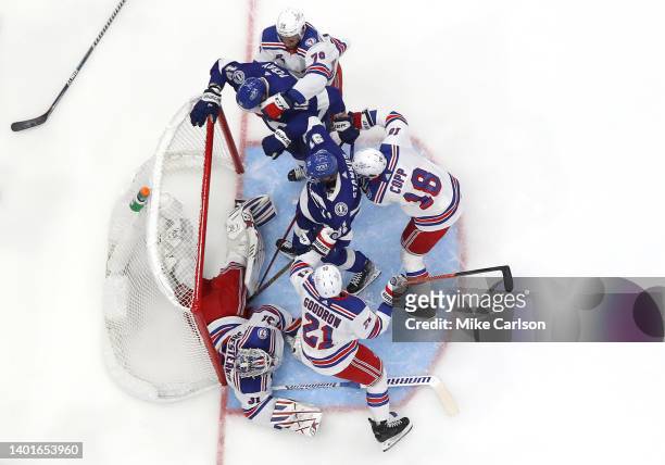 Igor Shesterkin of the New York Rangers dives on the puck to make a save against the Tampa Bay Lightning during the first period in Game Four of the...