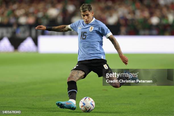 Mathías Olivera of Team Uruguay kicks the ball during an international friendly match at State Farm Stadium on June 02, 2022 in Glendale, Arizona....