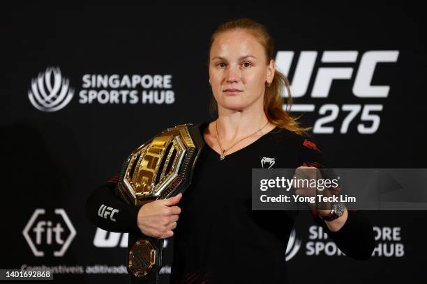 Flyweight champion Valentina Shevchenko of Kyrgyzstan poses with her belt after speaking to media ahead of her title defense bout against Taila...
