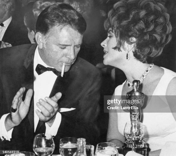 Married actors Elizabeth Taylor and Richard Burton attend the BAFTA Awards dinner at Grosvenor House in London, 26th April 1967. They won the Best...