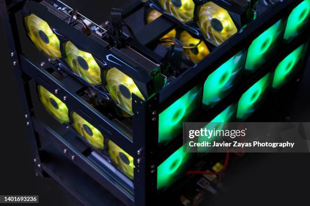 crypto currency mining rig on dark background - data mining foto e immagini stock